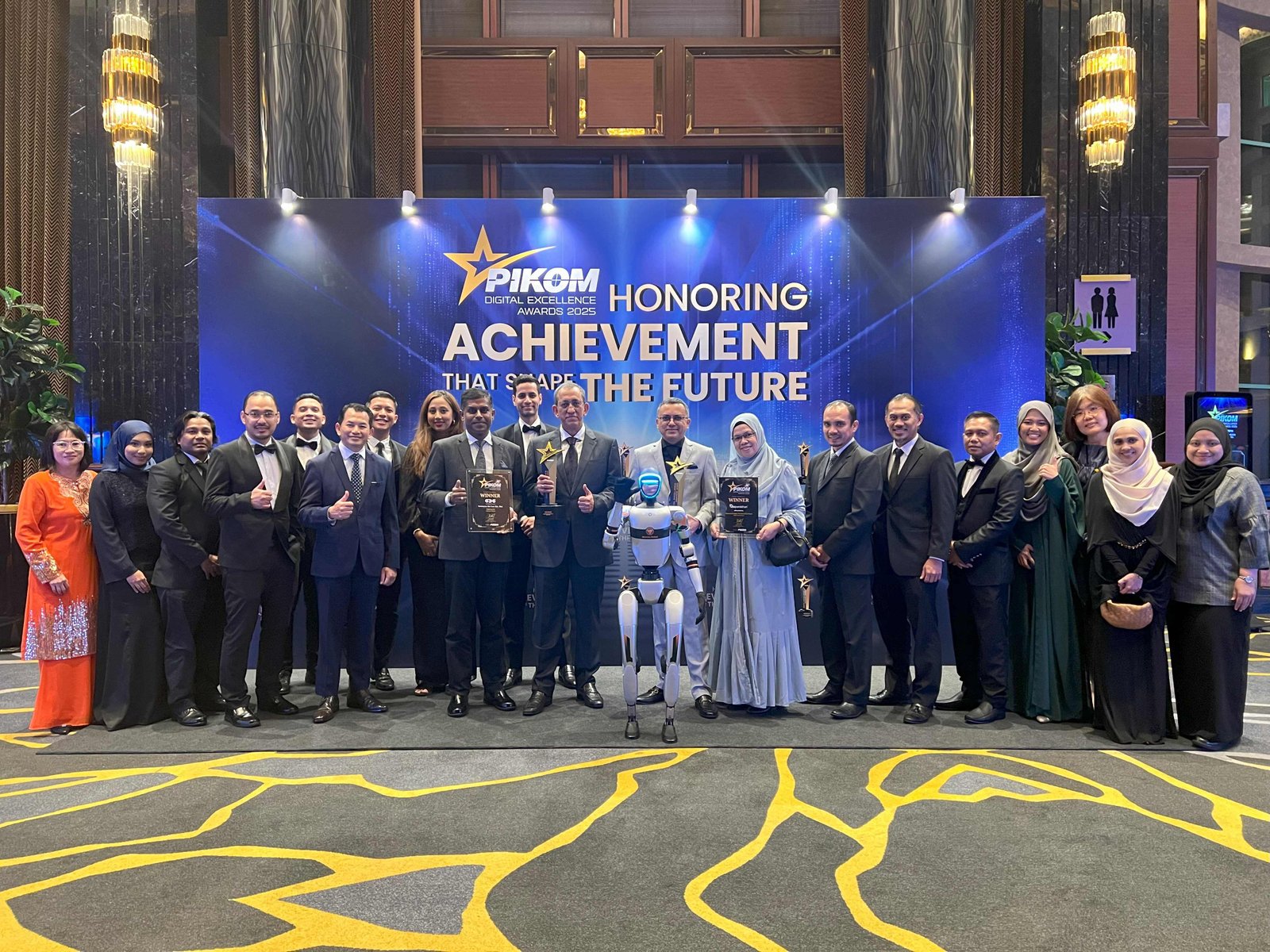 Commerce Dot Com Wins Double Honours At PIKOM Digital Excellence Awards 2025 2 Group photo of CDC and MOF at the PDEA 2025 Gala Dinner at Sunway Resort Hotel.