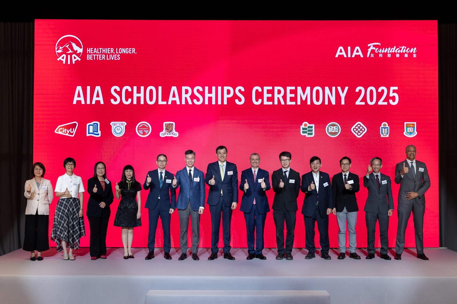 AIA Foundation celebrates 30th anniversary with award of AIA Scholarships to the 5th cohort and launch of "AIA Purpose in Action" initiative 2 Mr. Jacky Chan, AIA Regional Chief Executive and Group Chief Distribution Officer; Co-chairman, AIA Scholarships Committee (seventh from left); Mr. Stuart A. Spencer, AIA Group Chief Marketing Officer; Co-chairman, AIA Scholarships Committee (sixth from right); and Mr. Alger Fung, Chief Executive Officer, AIA Hong Kong & Macau; Director of AIA Foundation (sixth from left), are pictured with representatives of the 10 universities at the celebration ceremony for the fifth cohort of AIA Scholarships recipients.