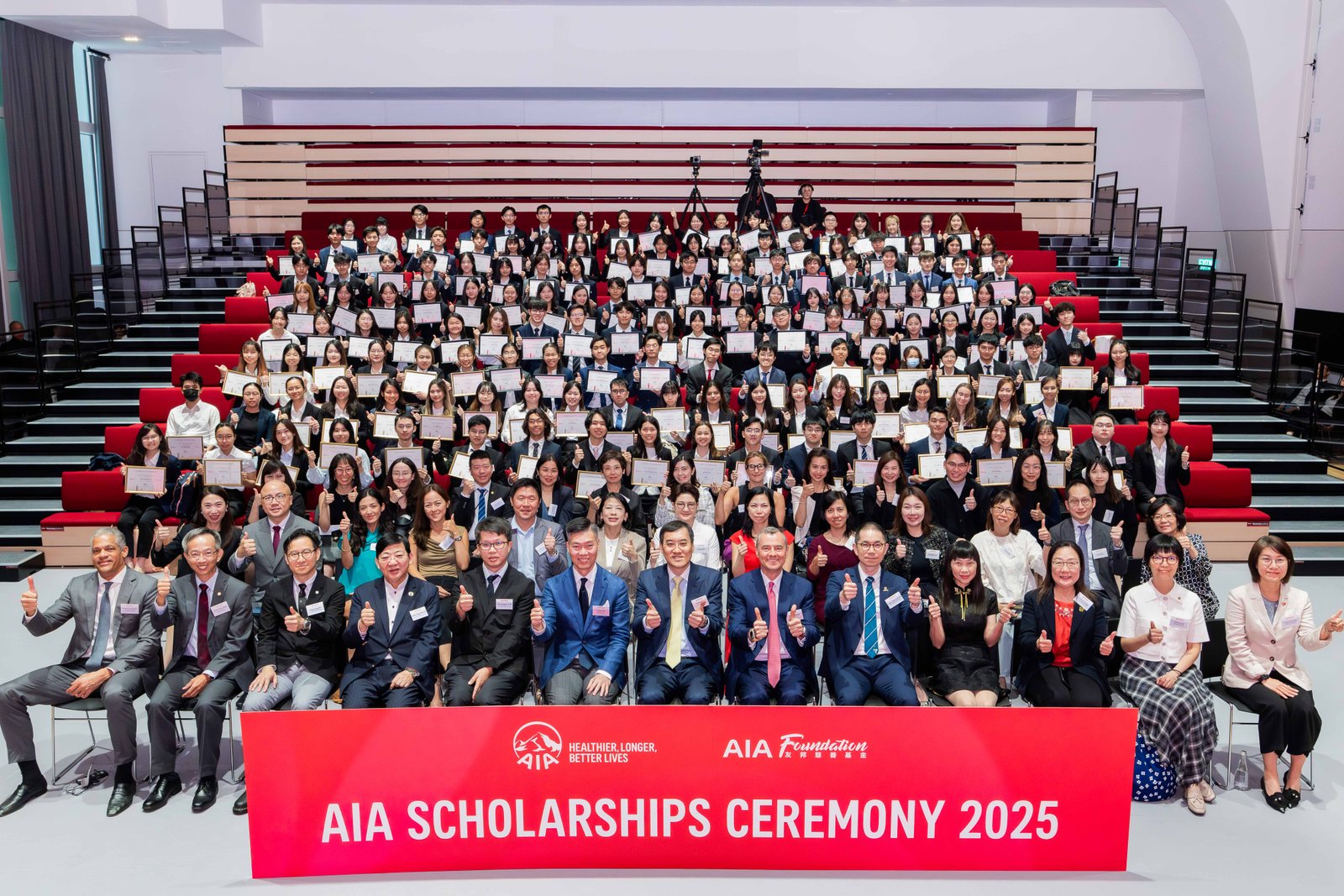 AIA Foundation celebrates 30th anniversary with award of AIA Scholarships to the 5th cohort and launch of "AIA Purpose in Action" initiative 3 Group photo of representatives from AIA Foundation, university representatives, representatives from partners, AIA Scholars, and graduates.